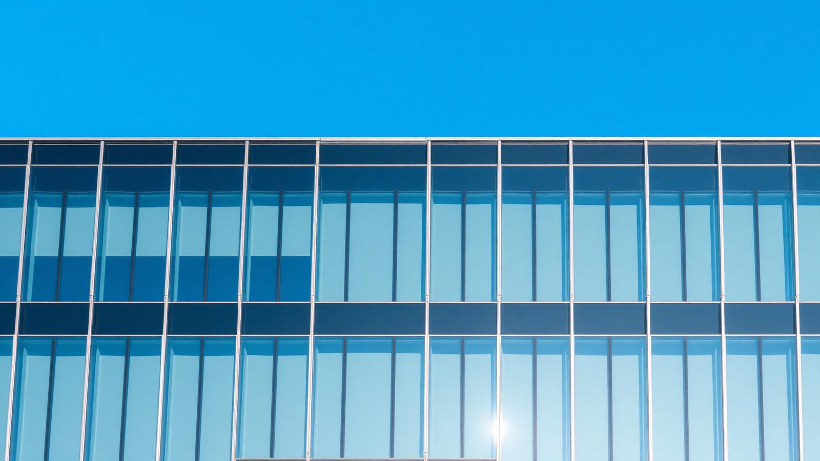 Office building with blue glass facade near Copenhagen